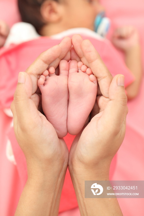 Close up of tiny feet of newborn baby