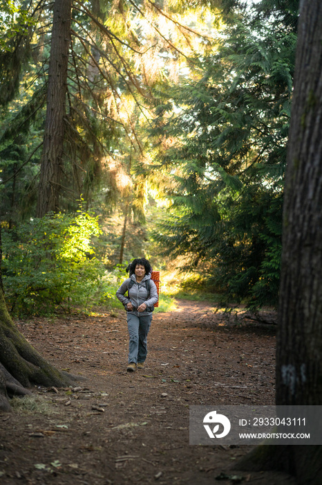 U.S. Army female soldier putting in the miles with an early morning hike in the NorthWest.