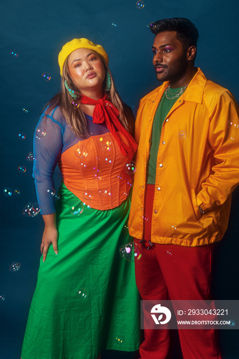 Asian duo fashion colour-blocked studio portrait