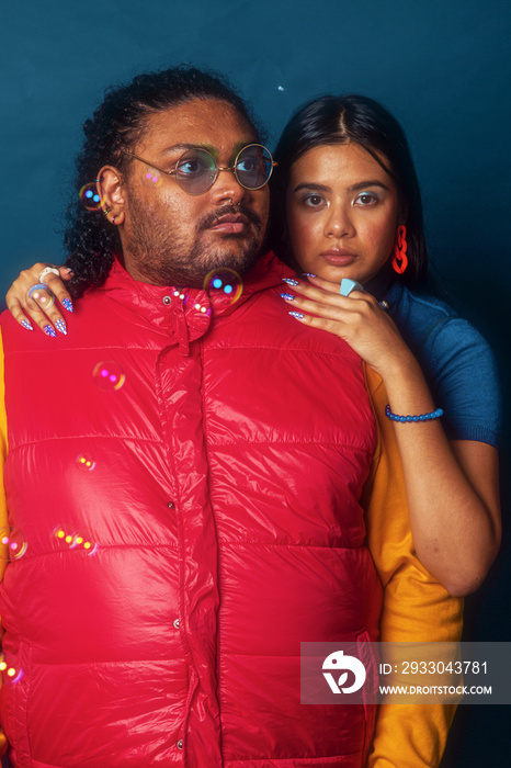 Asian duo fashion colour-blocked studio portrait