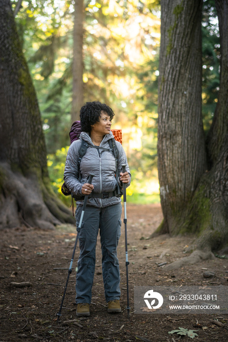 U.S. Army female soldier putting in the miles with an early morning hike in the NorthWest.