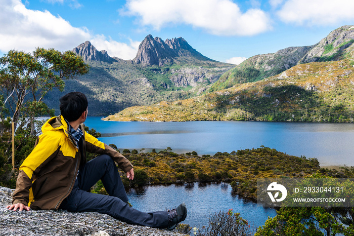 Traveller man explore landscape of Marions lookout trail in Cradle Mountain National Park in Tasmania, Australia. Summer activity and people adventure.