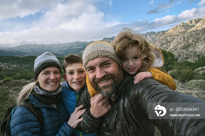 Family making a selfie in the mountain