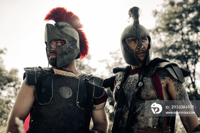 Portrait of two ancient warriors in battle dress.