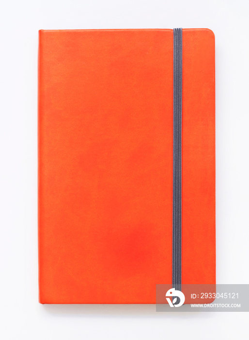 Orange closed notebook mockup isolated on white