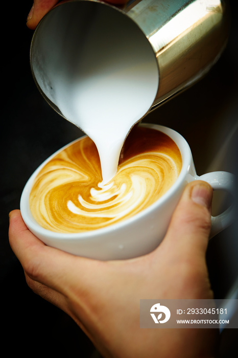 Close-up of barista hands in cafe