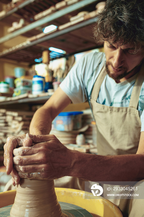 Creating a jar or vase of white clay close-up. Master crock.