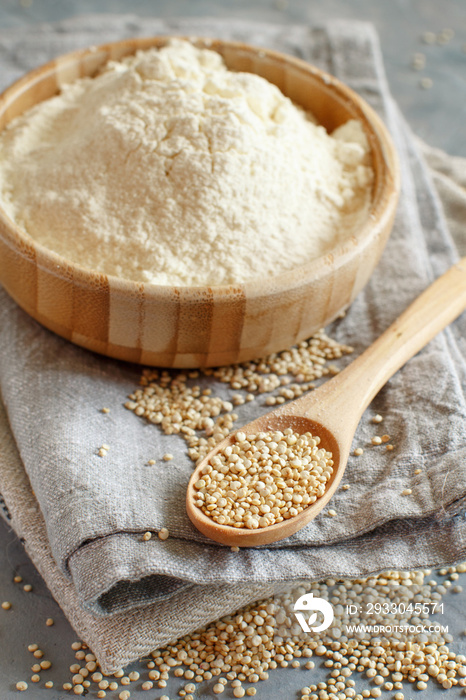 Raw white quinoa seeds and flour close up