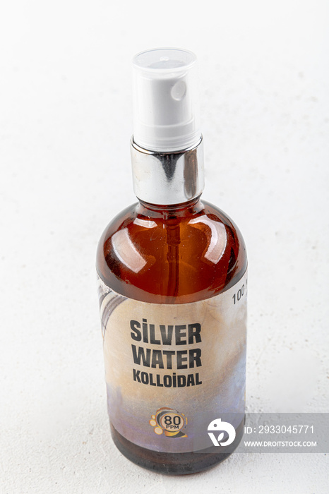 Bottle of colloidal water (Silver water) isolated on white background.