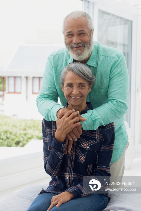 Couple smiling inside a room