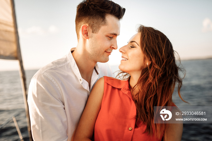 Love on the ship, couple in love hug on a yacht at sea.