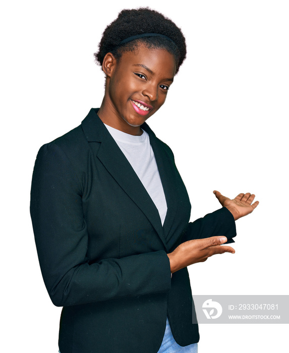 Young african american girl wearing business clothes inviting to enter smiling natural with open hand