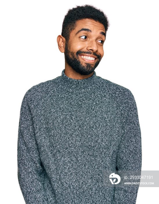 Young african american man wearing casual clothes smiling looking to the side and staring away thinking.