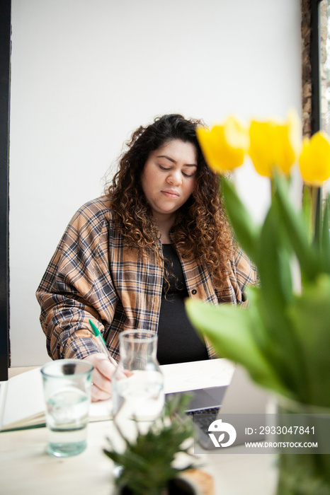 Plus-sized Sri Lankan woman with vitiligo in her home office