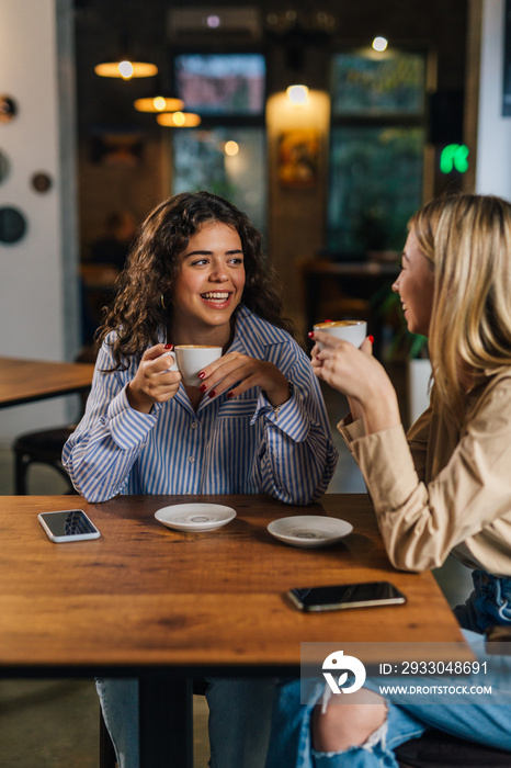 Two women hang out in a cafe