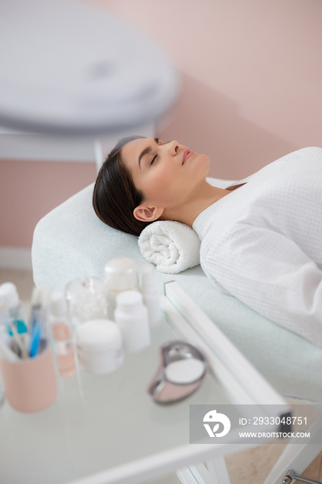 Beautiful young woman resting at spa salon