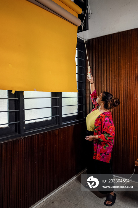 Plus sized female getting her headshots taken by a south asian female photographer