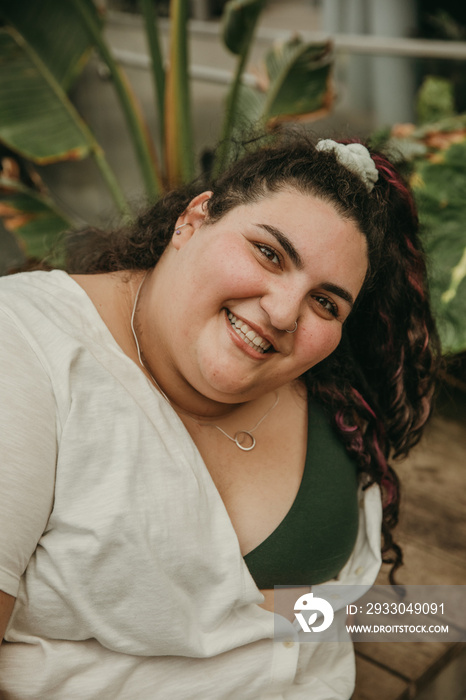 closeup portrait of a plus size woman smiling