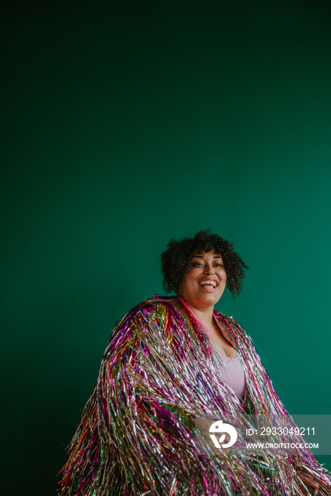 portrait of a plus size Black person smiling and dancing