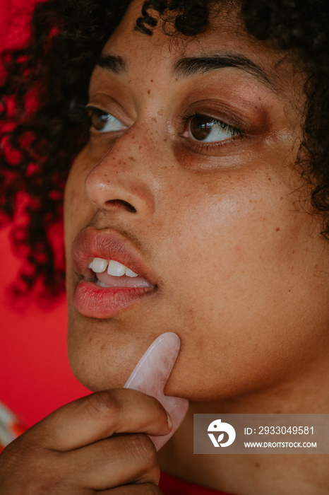 closeup of black agender person practicing skincare