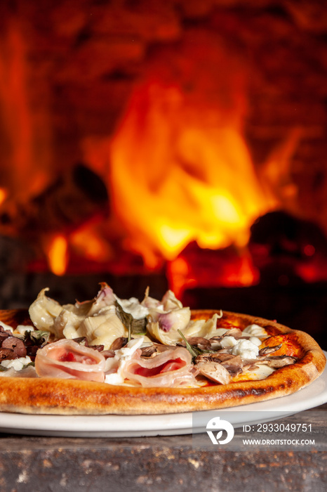 Baked pizza in the wood oven