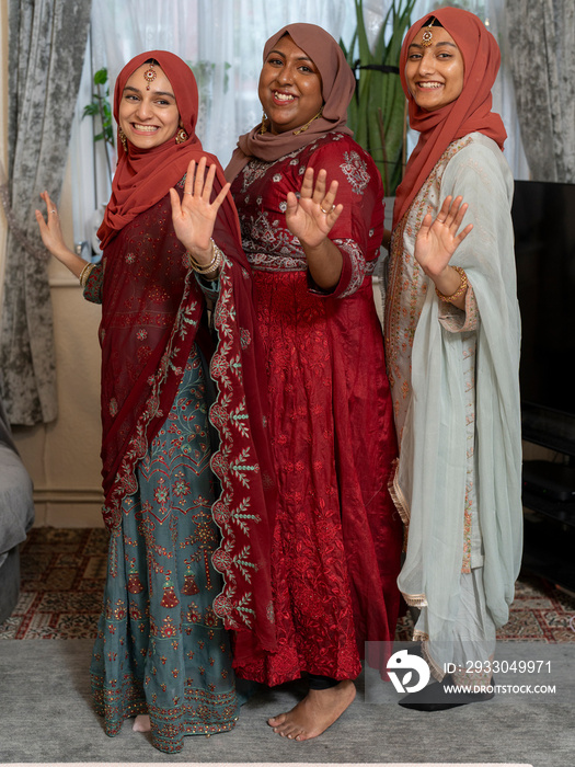 Women dancing during Ramadan celebration at home