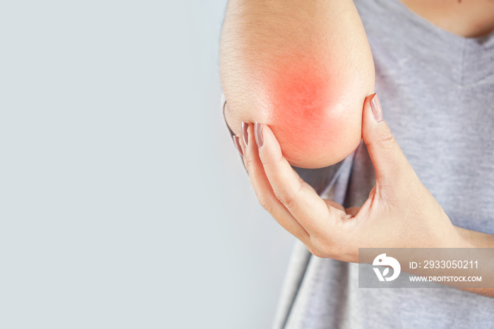 woman suffering from elbow  pain and injury concept