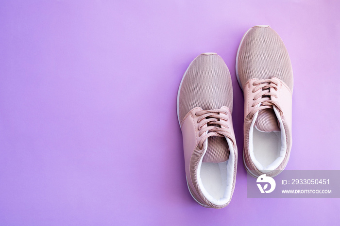 pink running shoes for women on a purple background