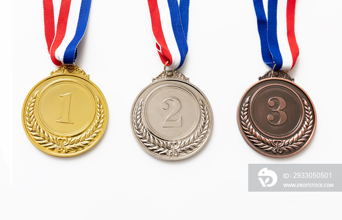 Gold, silver and bronze medals set on white background. Sports athletes winners prize