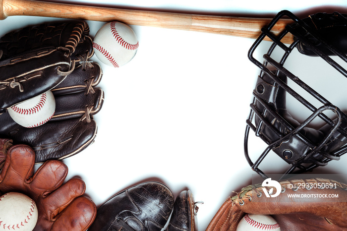 A group of vintage baseball equipment on a white background