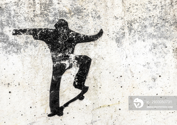 Skateboarding themed stencil graffiti