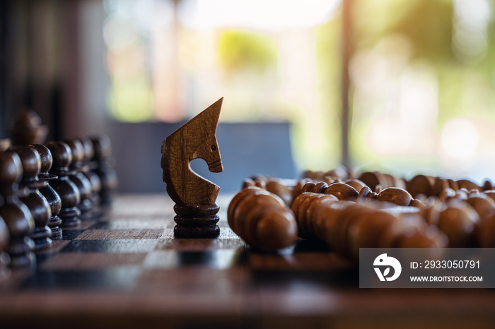 Closeup image of a horse win another chess on wooden chessboard