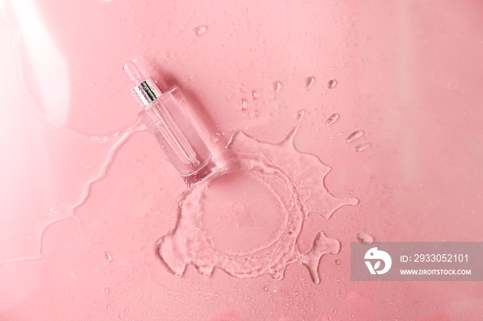 Glass Bottle with fluid collagen and hyaluronic acid, hydration skin. Top flatlay view copyspace. Abstract water pink background