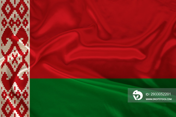 beautiful photo of a colored national flag of the modern state of Belarus on a textured fabric, concept of tourism, emigration, economy and politics, closeup