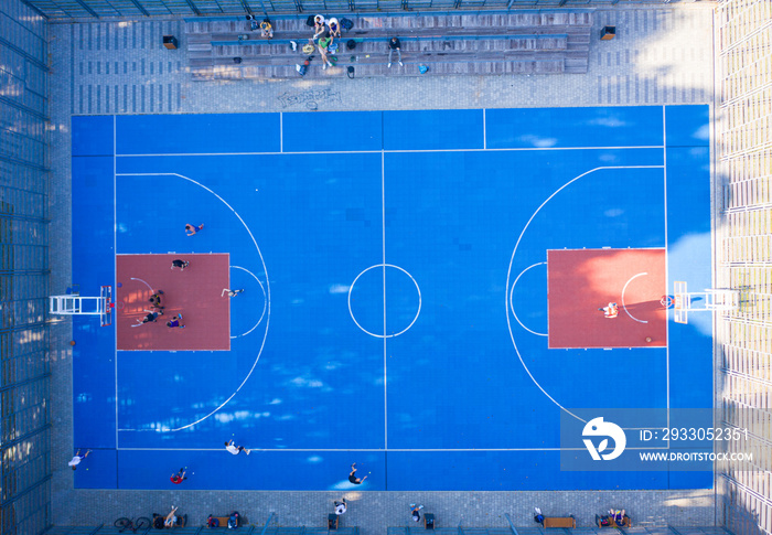 view on basketball court from drone. people playing basketball