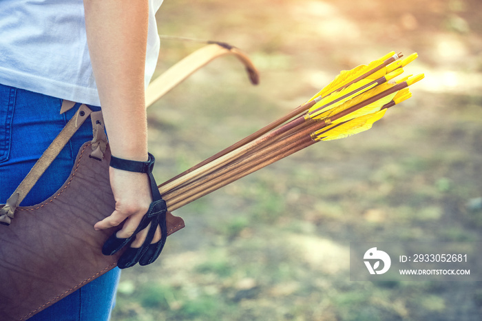 Athlete aiming at a target and shoots an arrow. Archery.