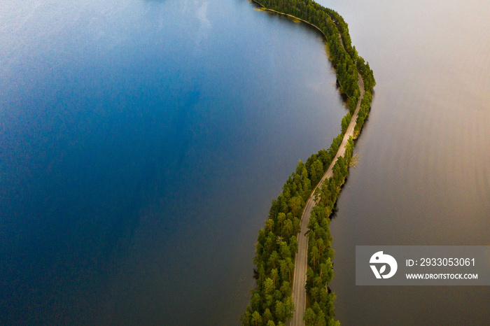 Aerial view of a ridge road through a lake in Punkaharju, Finland