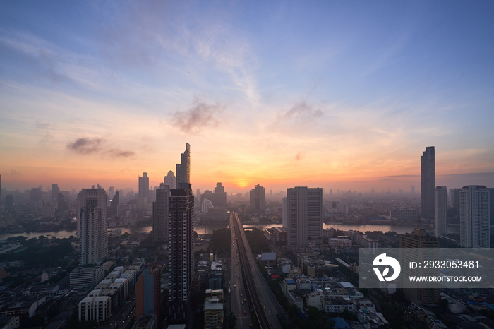 cityscape of sunrise with skyline and bridge cross the river