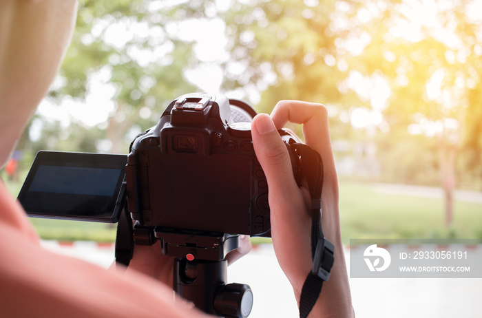 photographer take photo on live view for landscape