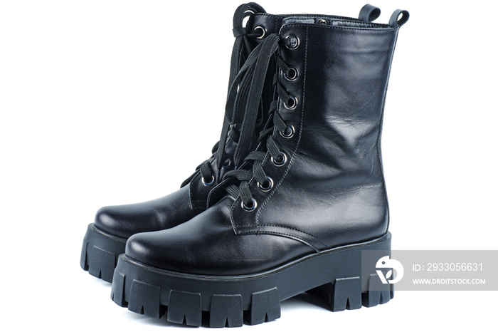 Black Leather Boots . Fashionable modern female Shoes Made of black Leather. Woman’s Military Style Boots.