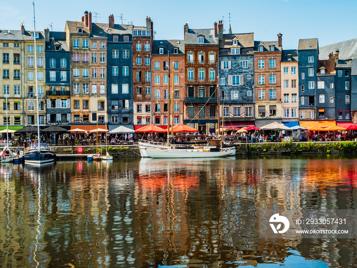 Impressive view of Honfleur waterfront with colorful houses reflected in the harbor, Normandy, France