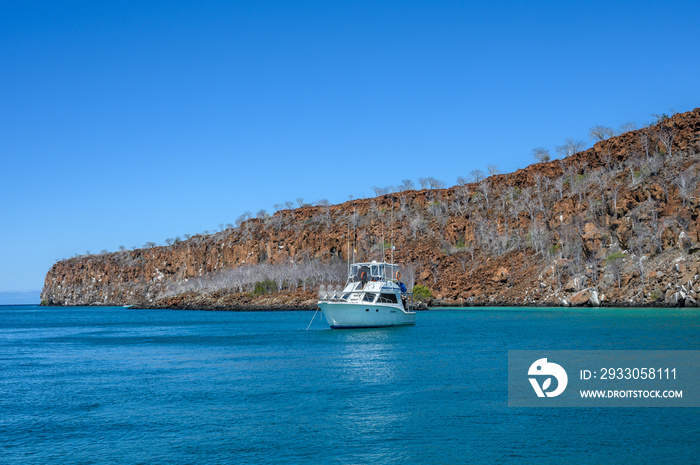 Landscape of Galapagos island with diving ship.