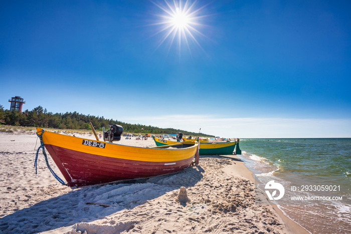 Fishing boat on the sunny Baltic Sea beach in Debki. Poland