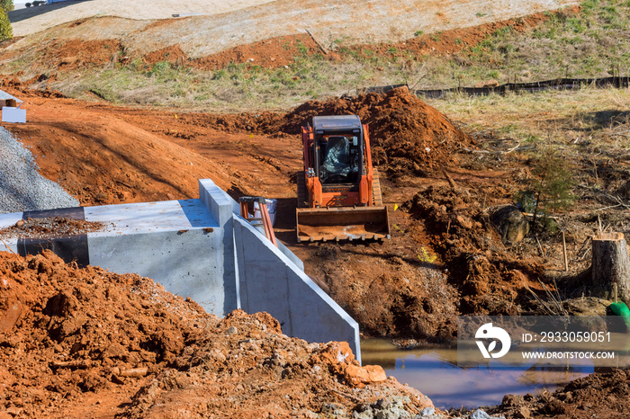 Reconstruction road and small bridge over drainage water canal during the repair