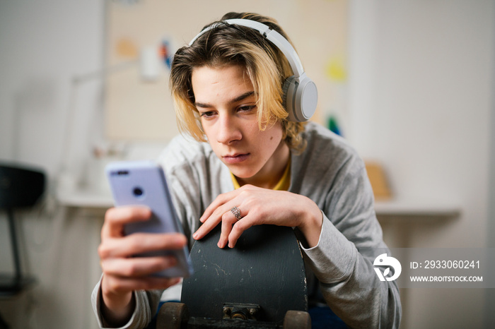 teenager boy using smartphone