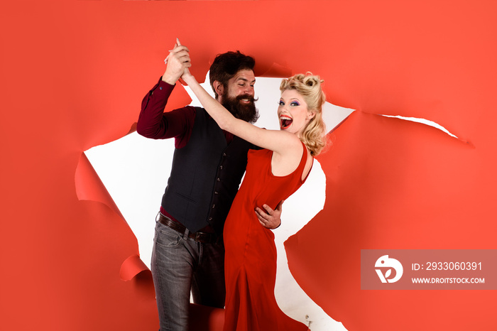 Happy couple enjoying dance. Stylish couple dancing. Romantic couple dance together at dance hall. Pretty woman and bearded man dancing. Dancing people in dance class. Cute young couple dancing.