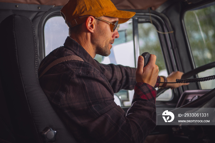 Truck Driver Talking On Radio.