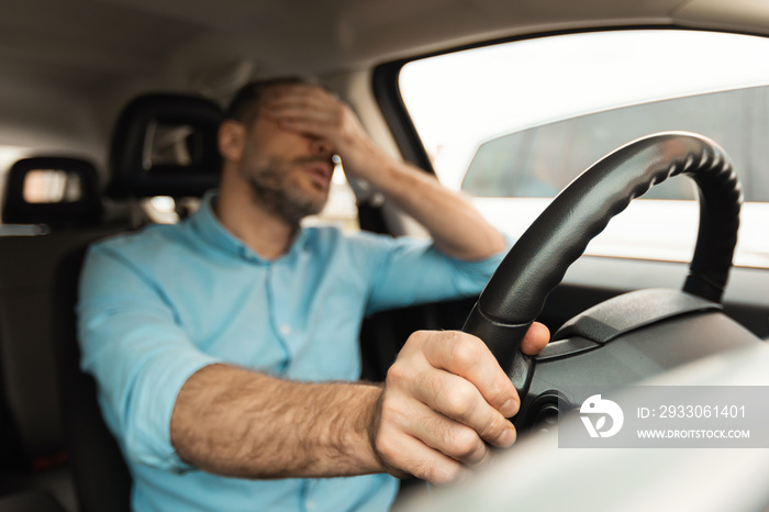 Tired Man Sitting In Car Stuck In Traffic Jam