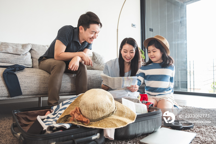 Asian family packing bag/luggage and planning to travel on summer vacation