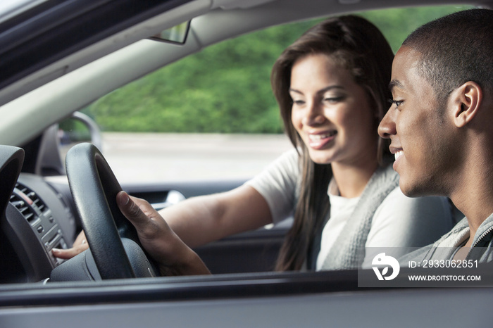 Teenagers driving car